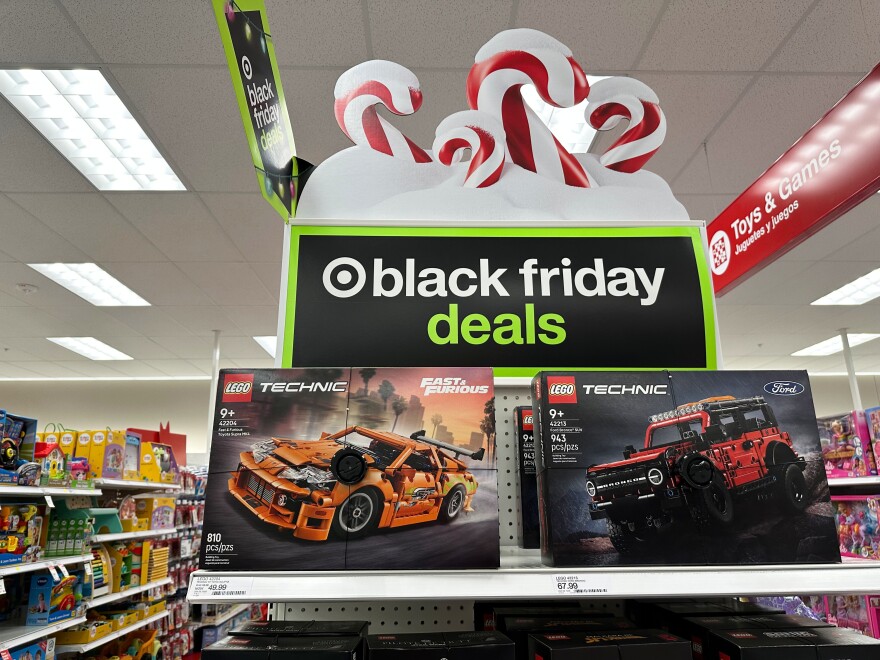 Signs mark special prices on toys as retailers roll out Black Friday deals, Wednesday, Nov. 26, 2025, in a Target store in southeast Denver.