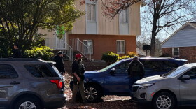 DHS agents surround a house on Archdale Drive in south Charlotte on Tuesday, Jan. 28, 2025.
