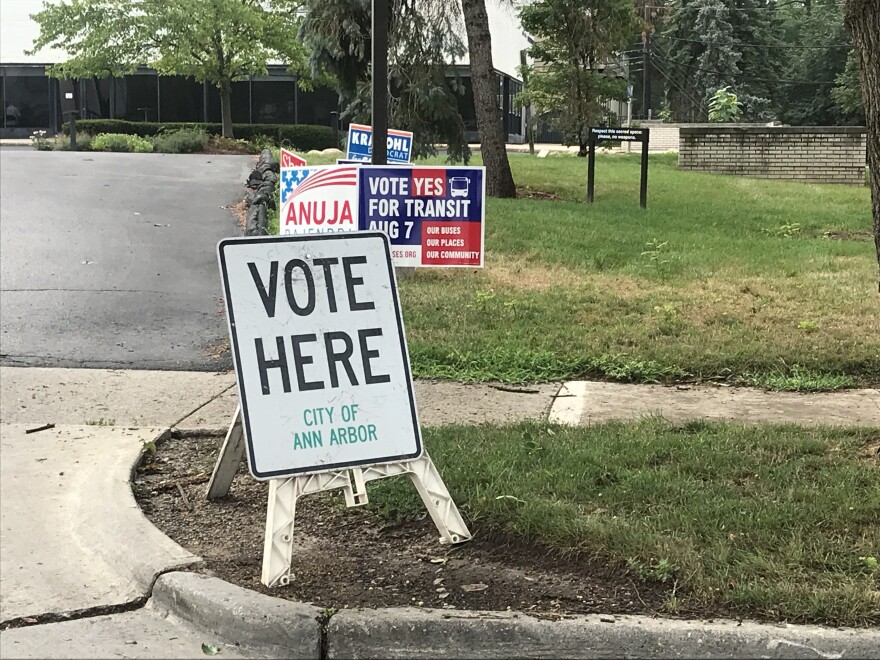 sign that says vote here