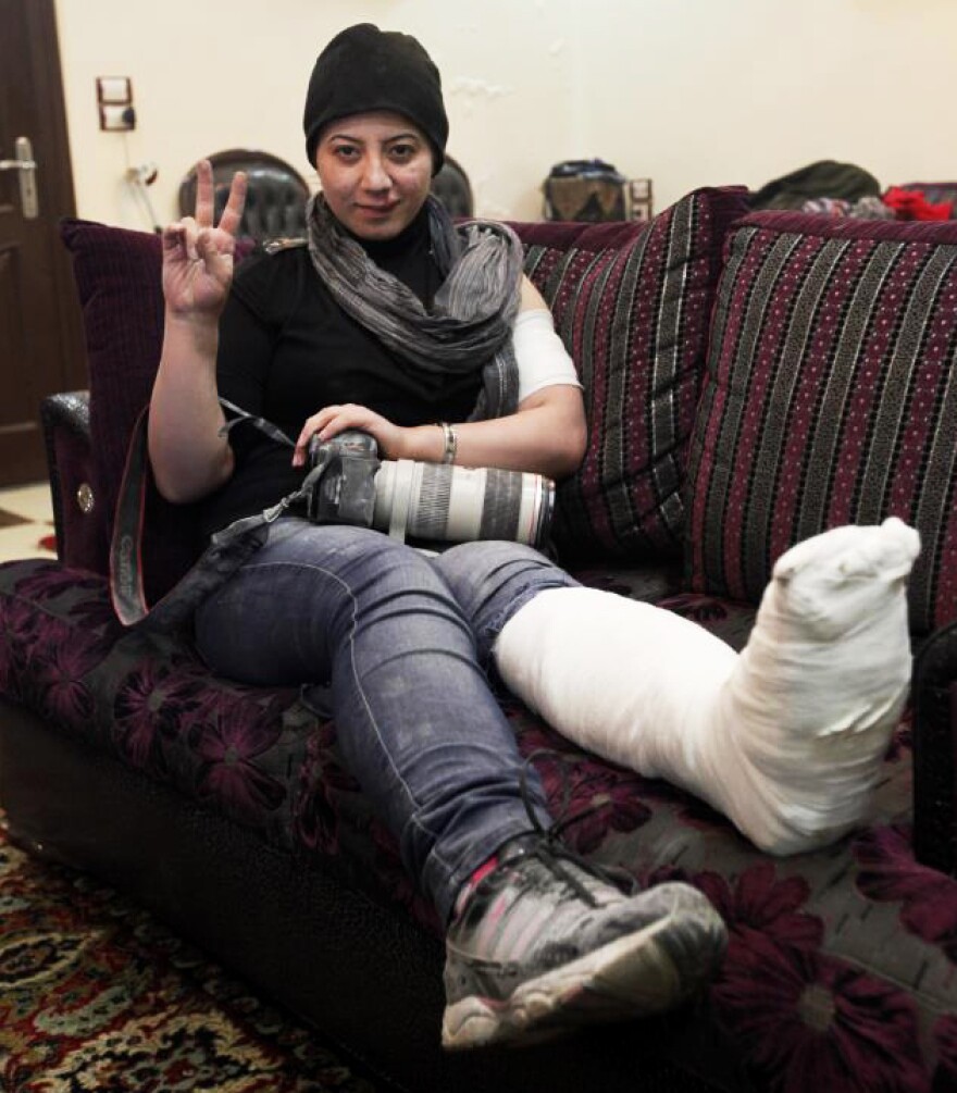 Kelze recently suffered a broken ankle when a wall collapsed on her during a firefight. She is recovering in Turkey, but plans to return to the front lines after she heals.