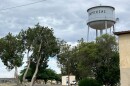 A water tower looms over the small town of Imperial in Pecos County, Texas, where for years drinking water has had excess radium.