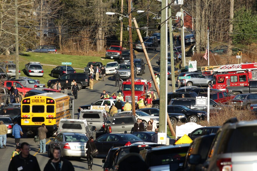 The chaotic scene outside the fire station in Sandy Hook after the shootings at Sandy Hook Elementary School in Newtown, Connecticut on December 14, 2012.