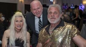 Amanda and Mark Mosely with (center) Frank Valente, president & CEO of the Humane Society of the Treasure Coast