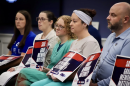 A row of nurses, patients and healthcare professionals hold signs that say, "Save Grady Memorial Maternity."