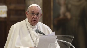 Pope Francis attends a inter-religious ceremony for peace in the Basilica of Santa Maria in Aracoeli, in Rome, on Tuesday.