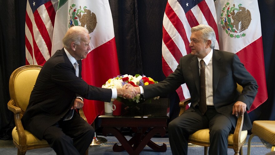Then-Vice President Joe Biden (left) shakes hands with then-Mexican presidential candidate Andrés Manuel López Obrador, during a meeting on March 5, 2012, in Mexico City.
