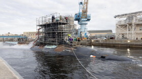 USS John Warner undergoes maintenance at Norfolk Naval Shipyard.