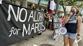 Demonstrators gather outside the Hawaii Convention Center in Honolulu, Saturday, Nov. 18, 2023, to protest a visit by Philippines President Ferdinand Marcos Jr., and recall the actions taken by his late dictator father, Ferdinand Marcos Sr. The younger Marcos and current president was in Honolulu for a whirlwind trip on the way home from the Asia-Pacific Economic Cooperation summit in San Francisco to emphasize U.S.-Philippines relations and meet with Filipino community members in Hawaii. (AP Photo/Jennifer Kelleher)