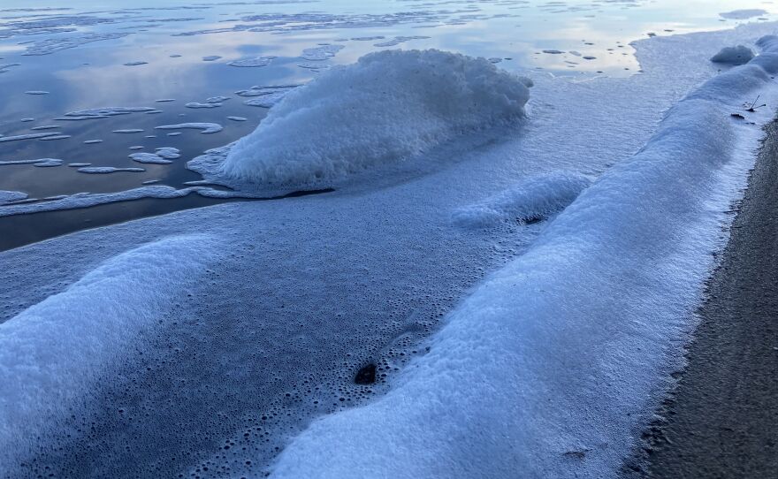 Foam washes up on the Mullet Lake shoreline in Cheboygan in November 2023. This sighting was reported to the Michigan Department of Environment, Great Lakes and Energy, but state officials say they can't confirm if foam contains PFAS based on photos without testing.