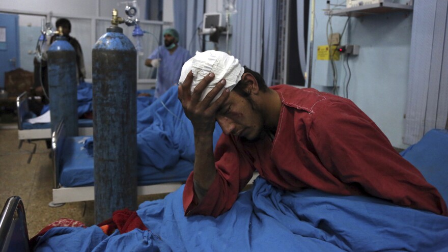 An injured man receives treatment at a hospital following a suicide bombing in Kabul, Afghanistan, on Tuesday.