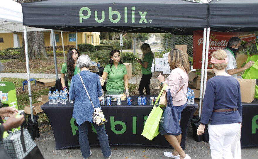 Publix provides free food to festival attendees during the 2022 Publix Tampa Bay Collard Festival in St. Petersburg, Florida, on Saturday, February 19, 2022. Photo by Octavio Jones for WUSF