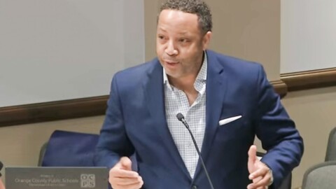 “I know when you all are going out knocking on doors to get voters,” Caissa K12 President Adrian Bond told the Orange County School Board members. “We're doing the same thing to get families.” Screenshot / OCPS via YouTube