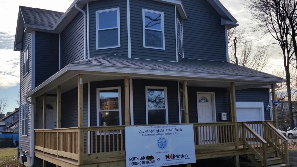 Two new houses sold to low-income families Two new houses sold to low-income families