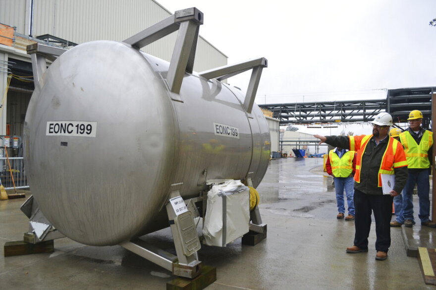 FILE - In this Oct. 27, 2015 file photo, Jeff Brubaker, site manager at the Blue Grass Chemical Agent Destruction Pilot Plant, points to a cylinder that will be used to moved deadly chemical weapons from storage to a new facility where they will be destroyed in Richmond, Ky. Senate Majority Leader Mitch McConnell, military leaders and Gov. Matt Bevin were in Richmond on Wednesday, May 29, 2019, to ceremonially mark the beginning of the elimination of more than 500 tons of mustard gas, sarin or VX agent stored at the Army depot. (AP Photo/Dylan Lovan, File)