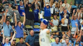 Kansas City Royals' Josh Rojas runs home to score the winning run on a bunt single hit by Nick Loftin during the ninth inning of a baseball game against the San Francisco Giants, Monday, July 20, 2026, in Kansas City, Missouri.