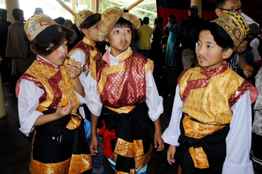 Tibetan children in Dharamsala, India, wait to perform during Monday's celebration.