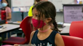 A Shawnee Mission elementary student in a mask.