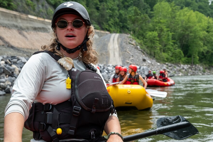 Heather Ellis leads tourists multiple times per day down the Pigeon River.