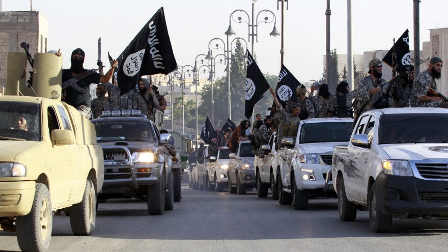 Islamic State fighters travel through the streets of Syria's northern Raqqa province on June 30. The group made territorial gains this year, but is now under attack from both the U.S. and Syrian militaries.