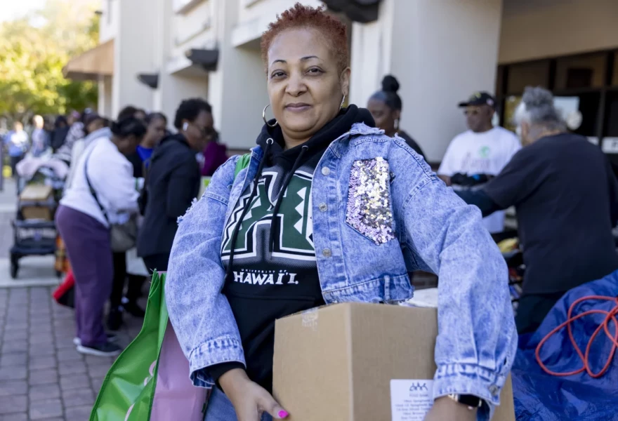Wanda Bright, a federal worker affected by the shutdown, picks up food from the Capital Area Food Bank in Hyattsville, Md., on Tuesday.