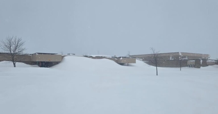 A side entrance to Cheboygan High School on Monday, March 16, 2026. Much of northern Lower Peninsula and eastern Upper Peninsula are under a blizzard warning through Tuesday morning.