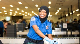 Philadelphia, Pa (June 24, 2019) A transportation security officer (TSO) from the Transporation Security Agency checks passenger's belongings at a security checkpoint at Philadelphia International Airport.