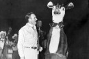 Gene Autry singing "Rudolph, the Red-Nosed Reindeer" at Madison Square Garden in 1949.
