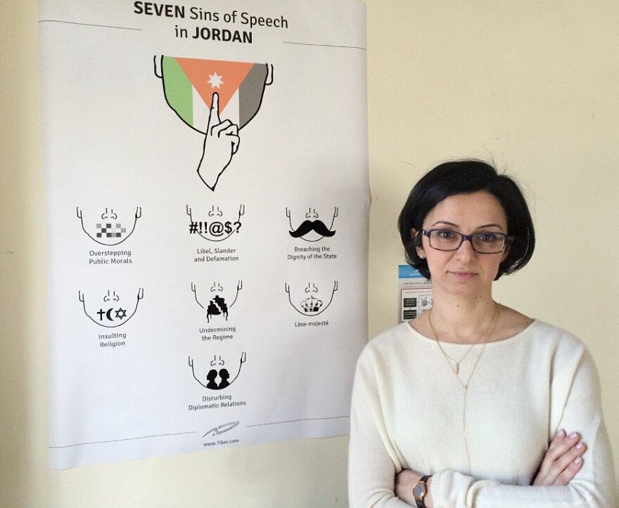 Lina Ejeilat helped found the Jordanian online magazine <em>7iber </em>(pronounced 'Hebber'). While the government encourages free expression in principle, many strict regulations remain, as noted by the satirical chart next to her.