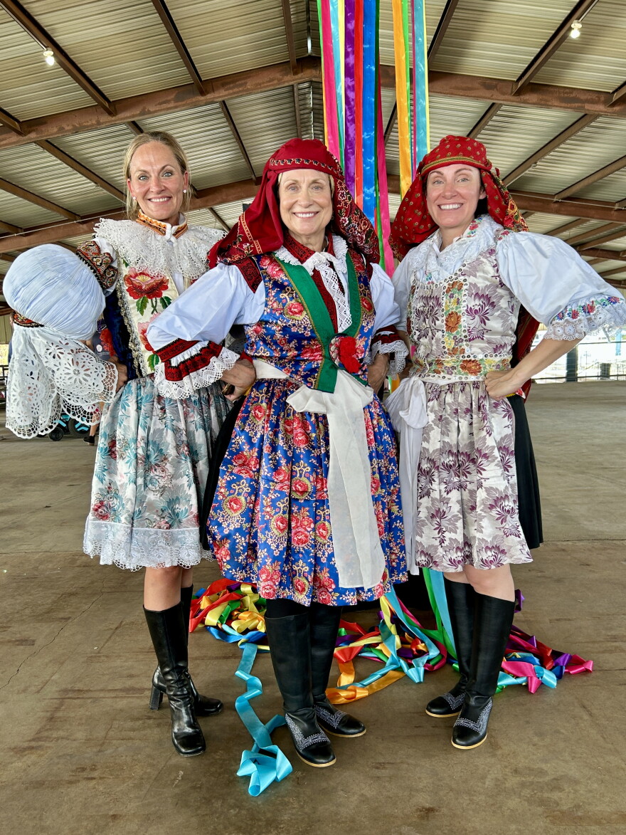 Kathy Podsednick, center, poses for a photo with two of her daughters after the Parade of Costumes at the 50th anniversary of Westfest. Podsednick is wearing a traditional Kroj gifted to her from a delegation from Kunovice, West's sister city in the Czech Republic.