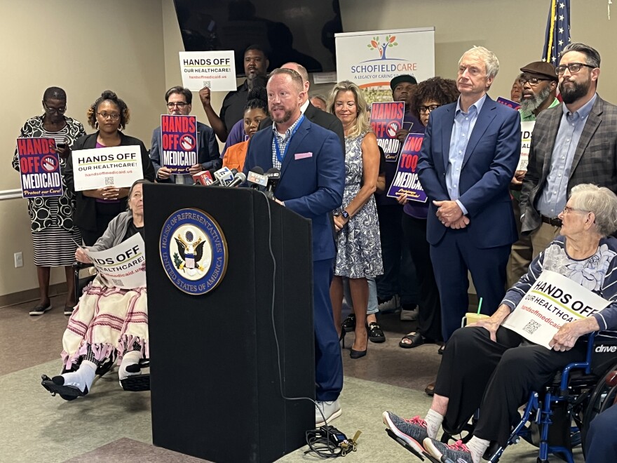 Chris Koenig (center) is CEO of Niagara Lutheran Health System, which operates the Schofield Residence in Tonawanda. He said spending reductions to Medicaid and overhauls of the system will lead to closures of nursing homes.