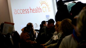 People wait to sign up for health coverage at Access Health CT, Monday, March 31, 2014, in New Britain, Conn. Today is the deadline to sign up for an Affordable Health Care insurance plan however, people who begin the enrollment process but aren't able to complete it by 11:59 p.m. because of a system issue may qualify for a special provision that will allow them to enroll after Monday night. (AP Photo/Jessica Hill)