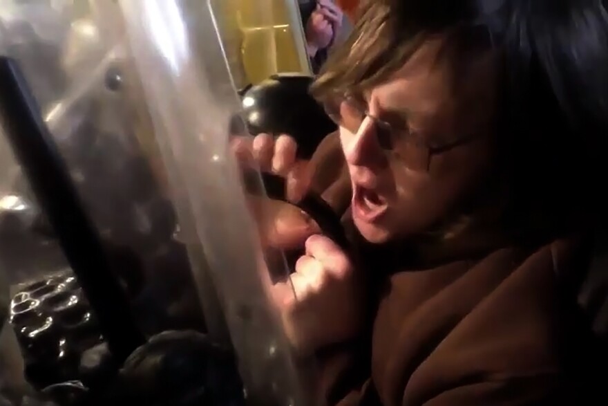 In this screen grab from video, Ridgefield, Connecticut resident Patrick McCaughey is shown in the Lower West Terrace tunnel of the US Capitol building on January 6, 2020. Federal prosecutors said he used a police riot shield to pin an officer to a door frame, as a crowd of rioters in the tunnel fought with officers and tried to force their way into the building.