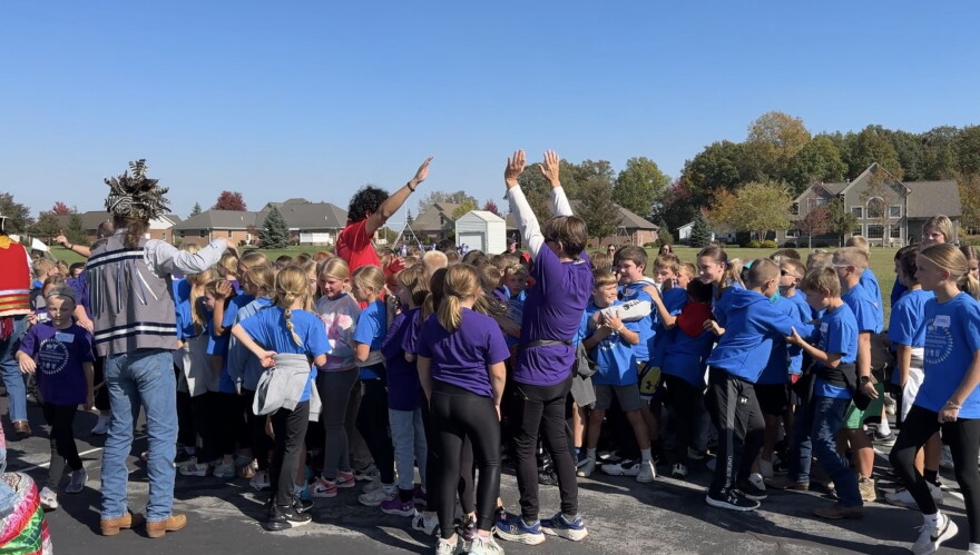 Students gathered around for a social dance to conclude their day.