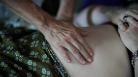 A pregnant patient is examined Aug. 31, 2023, in Summertown, Tenn.