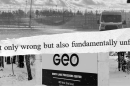 A black-and-white collage with three horizontal layers. The top image features a high-security fence with razor wire and a transport van. A jagged, torn-paper strip is overlaid across the center with the text: "not only wrong but also fundamentally unfair." The bottom image is a sign for the "GEO North Lake Processing Center" located at 1805 West 32nd Street. The sign and surrounding ground are covered in a layer of snow, with trees visible in the background.