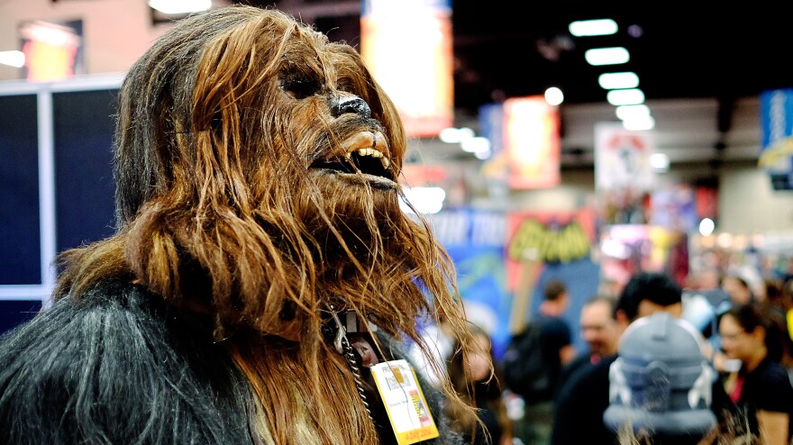 Christopher Petrone, of San Diego, CA, towering over attendees in his handmade, to-scale Chewbacca costume.