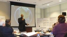 Chief Operating Officer Roosevelt Brown explains part of the \"right-sizing plan\" to the school board. Photo by Sylvia Maria Gross / KCUR.