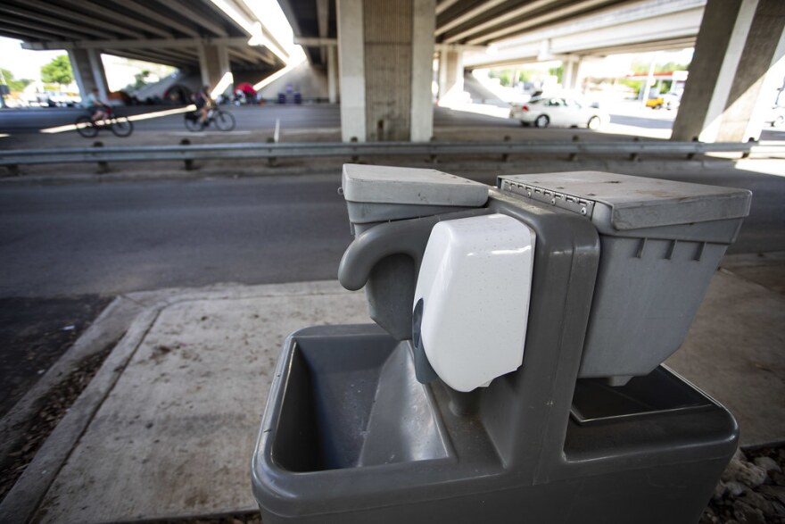 Portable bathrooms and hand washing stations were installed near a camp for people experiencing homelessness in South Austin during the pandemic.