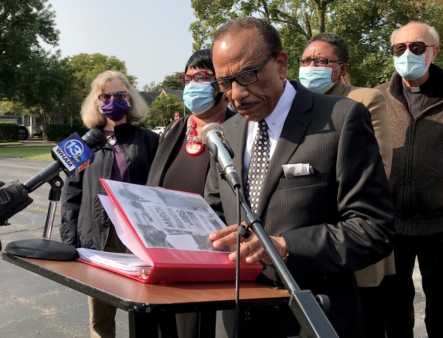 Rev. Lewis Stewart with the United Christian Leadership Ministries spoke outside of the First Church of God on Clarissa St. in Rochester on Wednesday.