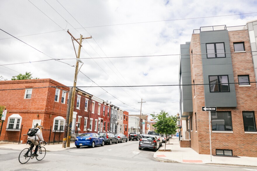 A bicyclist rides down a street in Point Breeze, one of the city’s fastest gentrifying neighborhoods. 