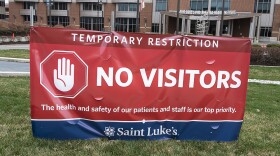 A sign at St. Luke's hospital in Kansas City, Missouri, advises visitors to stay away to prevent the spread of Covid-19.