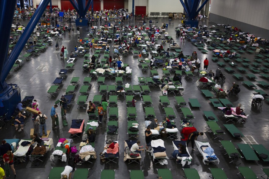 Evacuees fill up cots at the George Brown Convention Center on Aug. 28 in Houston.