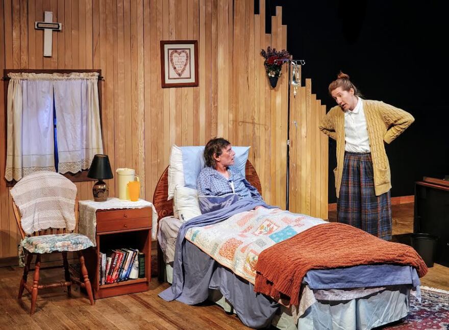 Mari Kenney as Annie Wilkes and Scott Smith as Paul Sheldon in dress rehearsal for Misery.
