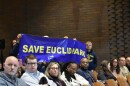 Community members hold a banner asking Cleveland Metropolitan School District to not close their school, Euclid Park on the city's Northeast Side.