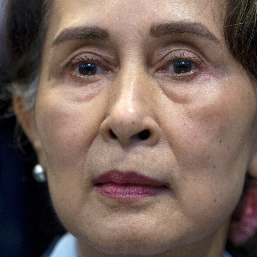 A Myanmar court on Monday sentenced ousted leader Aung San Suu Kyi to four years for incitement and breaking virus restrictions. In this photo from December 2019, Suu Kyi waits to address judges of the International Court of Justice on the second day of three days of hearings in The Hague, Netherlands.