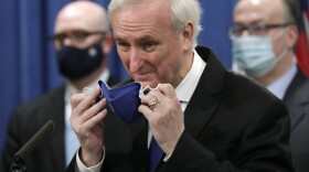 Deputy Attorney General Jeffrey A. Rosen addressed a press conference at the Justice Department in October. He'll now run the show there until the arrival of the incoming Biden administration.