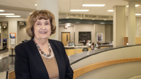 Johnette McKown, president of MCC, poses for a photo in front of the learning commons named in her honor. McKown announced she would retire in May after 17 years as president.