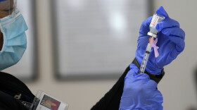 In this Jan. 28, 2021, file photo, a nurse prepares a COVID vaccine in Pittsboro, N.C. at Piedmont Health Senior Care, a federally qualified health center where PACE patients (Program of All-Inclusive Care for the Elderly) and underserved populations are receiving the coronavirus vaccine. 