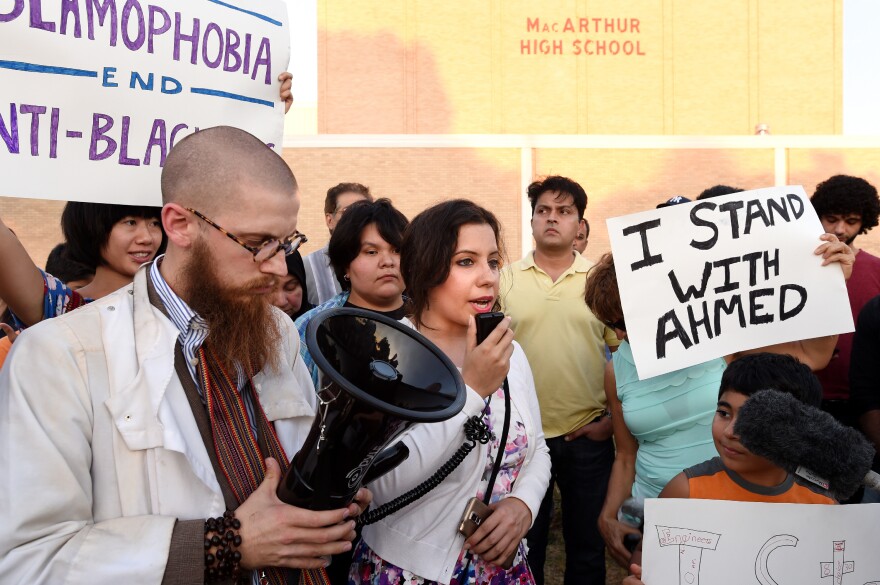 Aisha U-kiu, president of American Muslim Professionals of Dallas and a graduate of MacArthur High School, speaks at a September prayer vigil in support of Ahmed Mohamed in Irving, Texas. Ahmed, 14, a student at MacArthur, was arrested there when a clock he built and brought into the building was mistaken for a bomb by teachers and police.