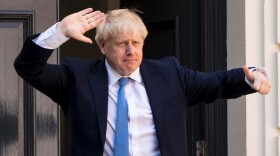 Boris Johnson, who has been elected the U.K.'s incoming prime minister, arrives at the Conservative Party's headquarters in central London on Tuesday.